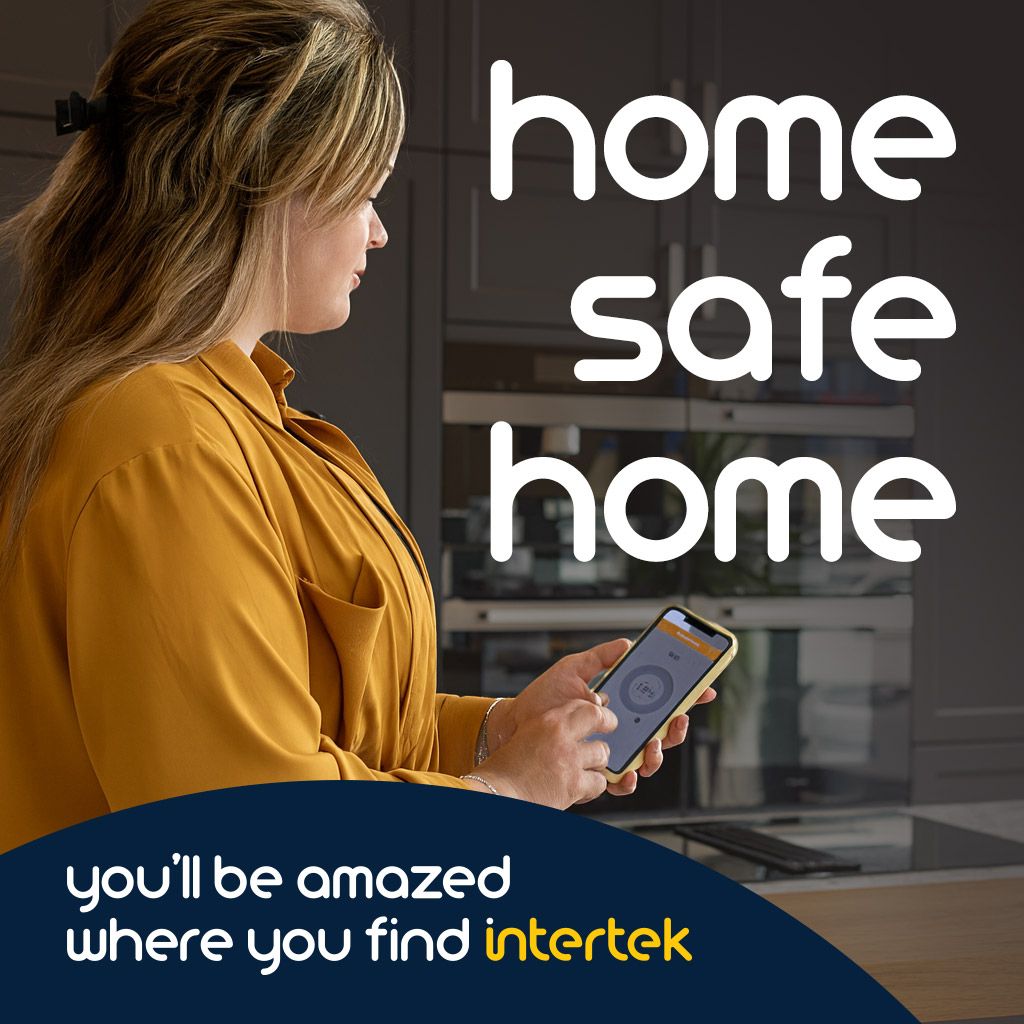 Woman using a smartphone in her kitchen